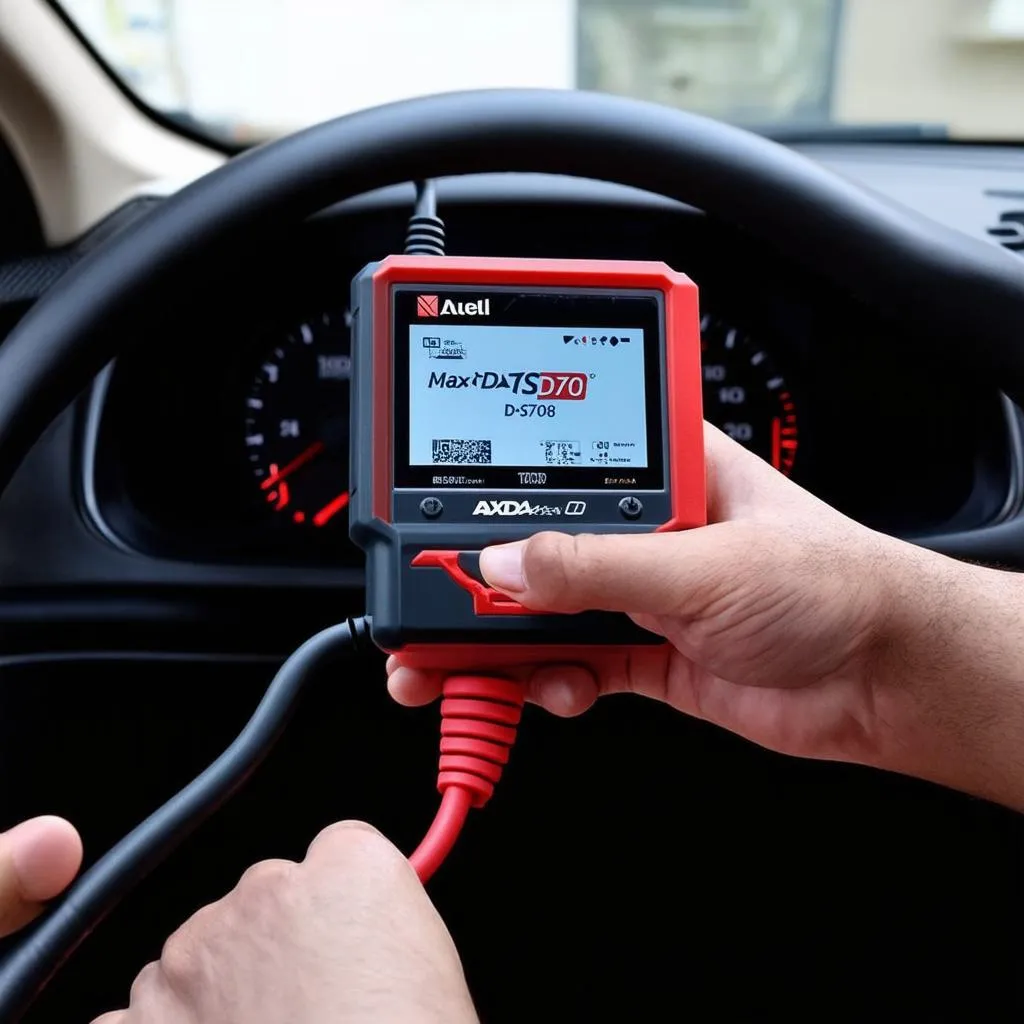 Autel MaxiDAS DS708 connected to a car's OBD-II port