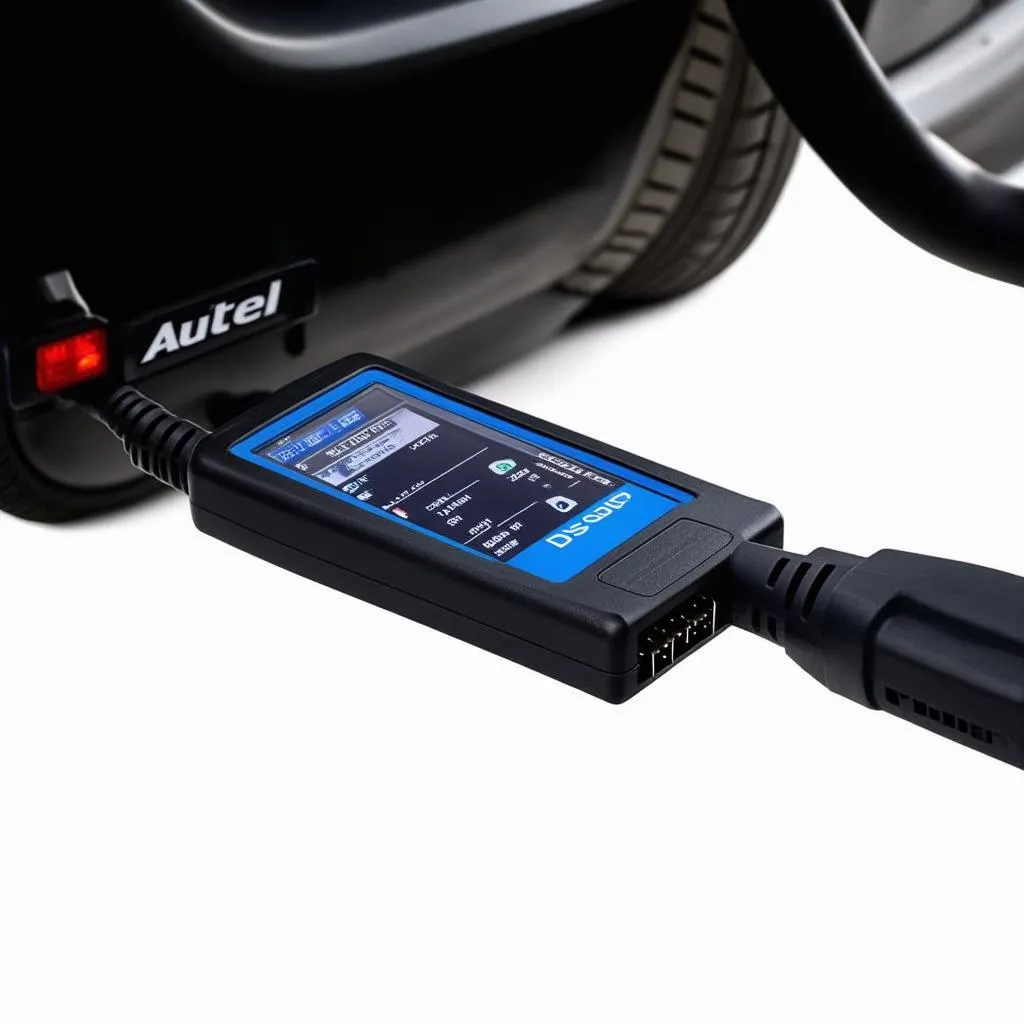 Autel MaxiDAS DS808 plugged into a car's OBD-II port