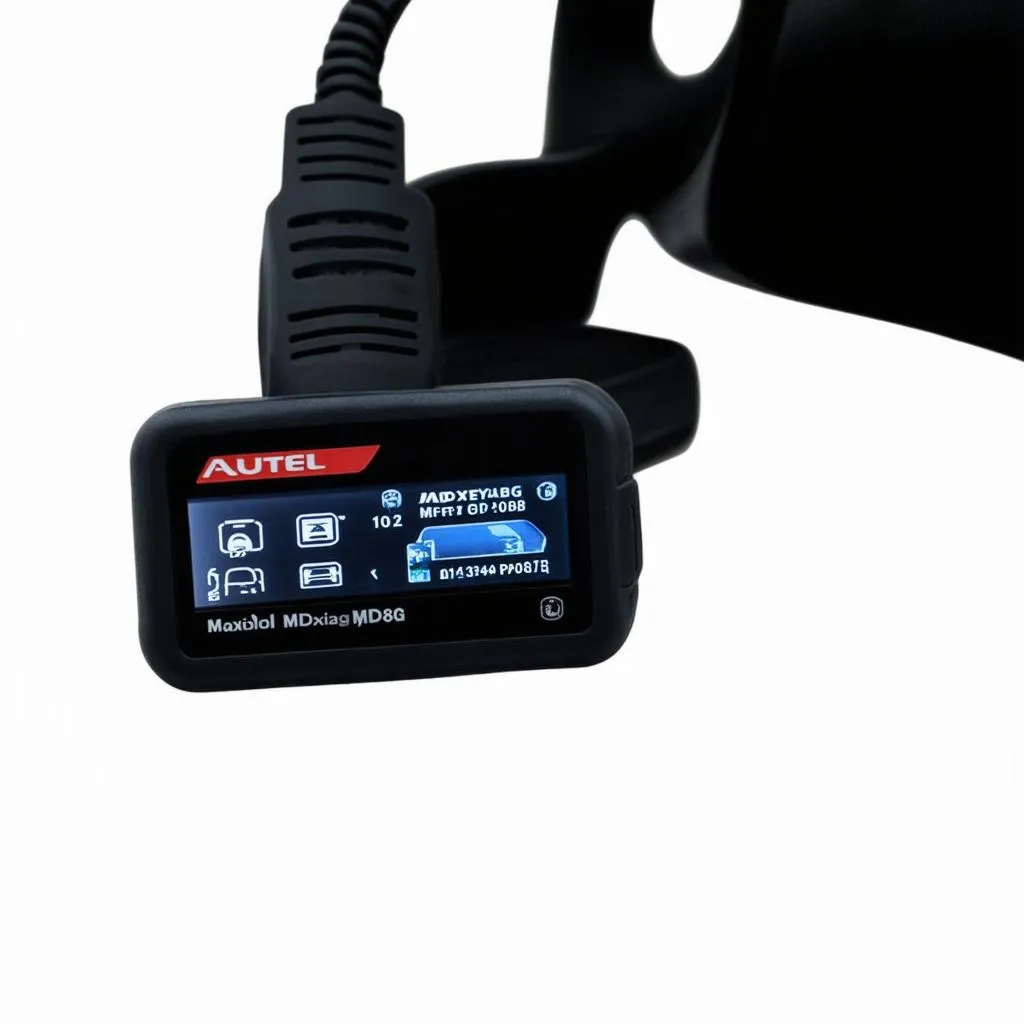 Autel MD808P plugged into a car's OBD port