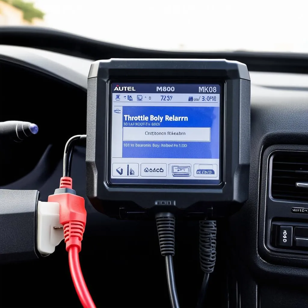 Autel MK808 connected to a car's OBD-II port