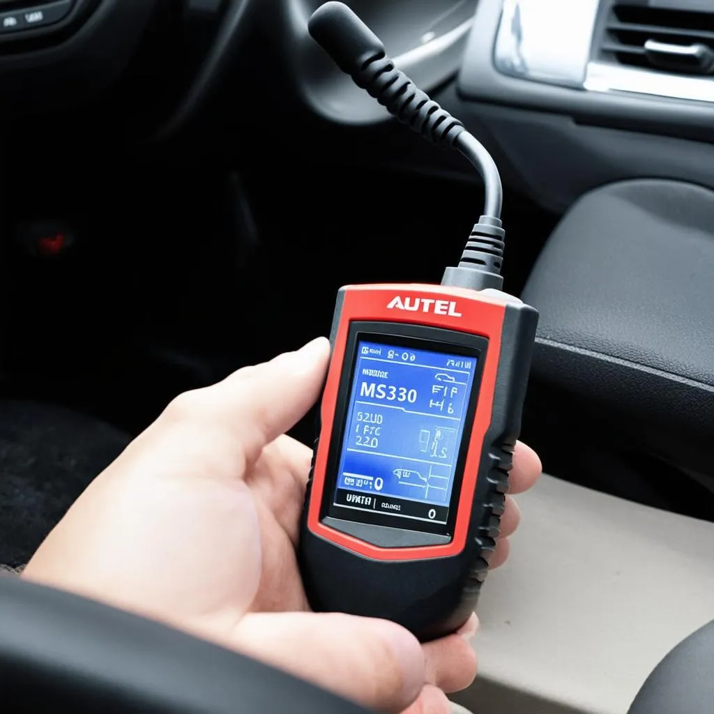 Autel MS300 connected to a car's OBD-II port