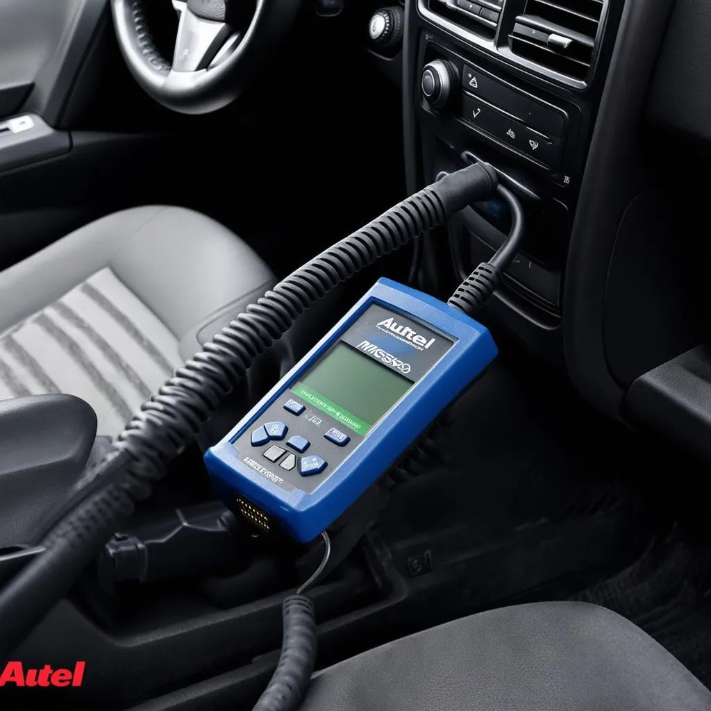 Autel MaxiScan MS609 connected to a car's OBD2 port