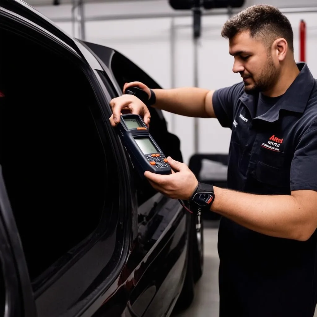 Mechanic using Autel MS906BT