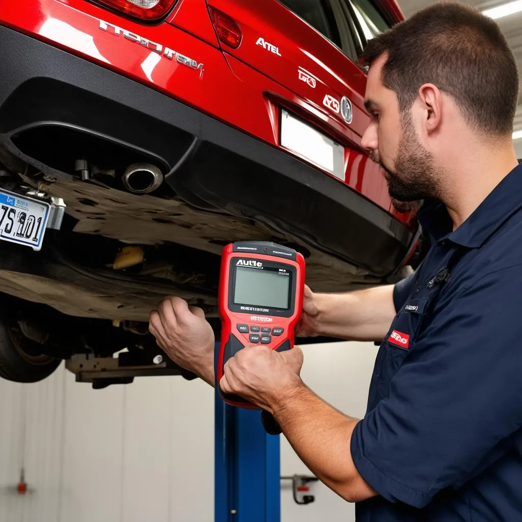 Mechanic using Autel TS601