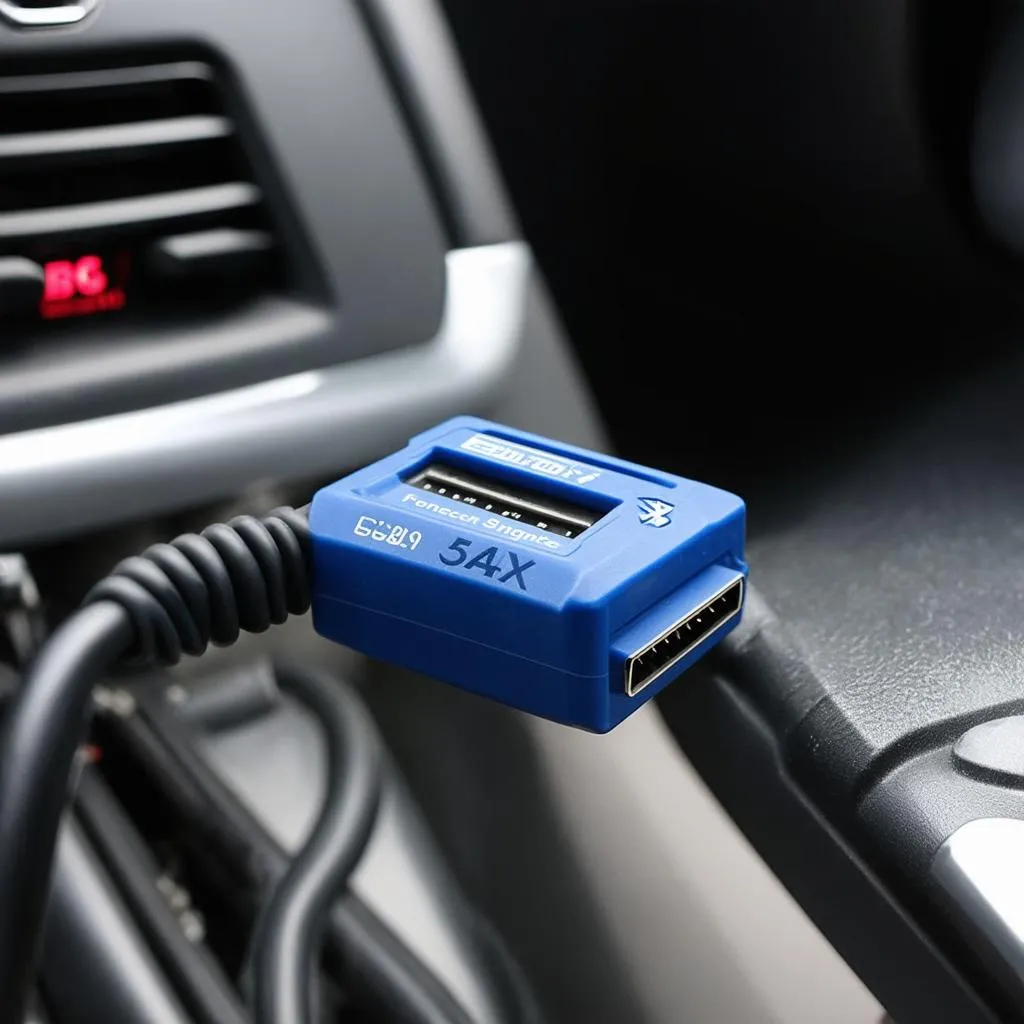 BAFX 34t5 Bluetooth OBDII Scan Tool connected to a car's OBDII port