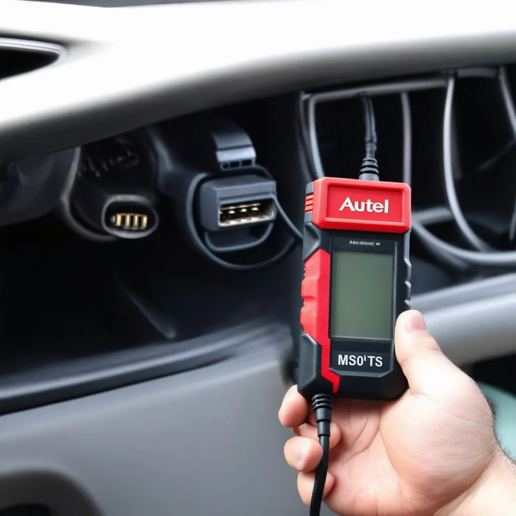 Autel MS906TS connected to a car