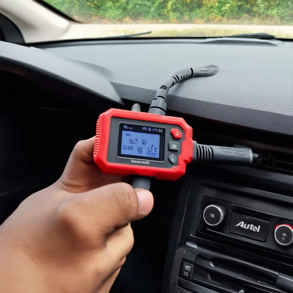 Autel Scanner on Car Dashboard