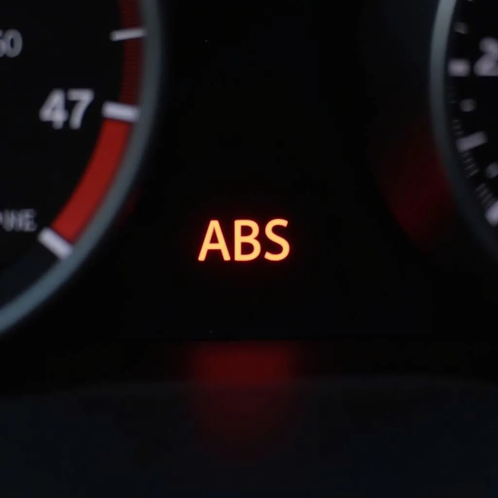 Car dashboard with ABS warning light illuminated