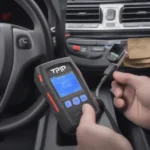 TPMS OBD2 Scan Tool Connected to the Vehicle's OBD2 Port