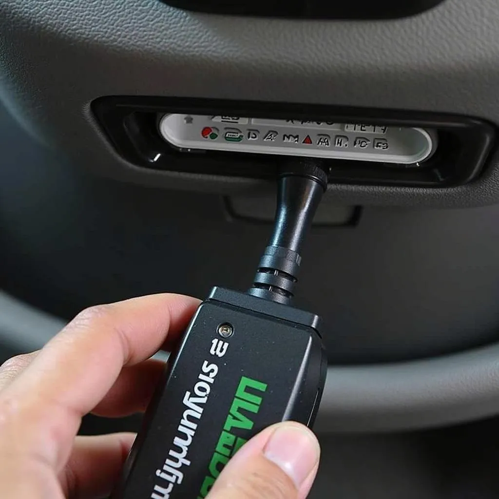 UltraGauge EM Plus OBD II Scan Tool Connected to a Car's Diagnostic Port