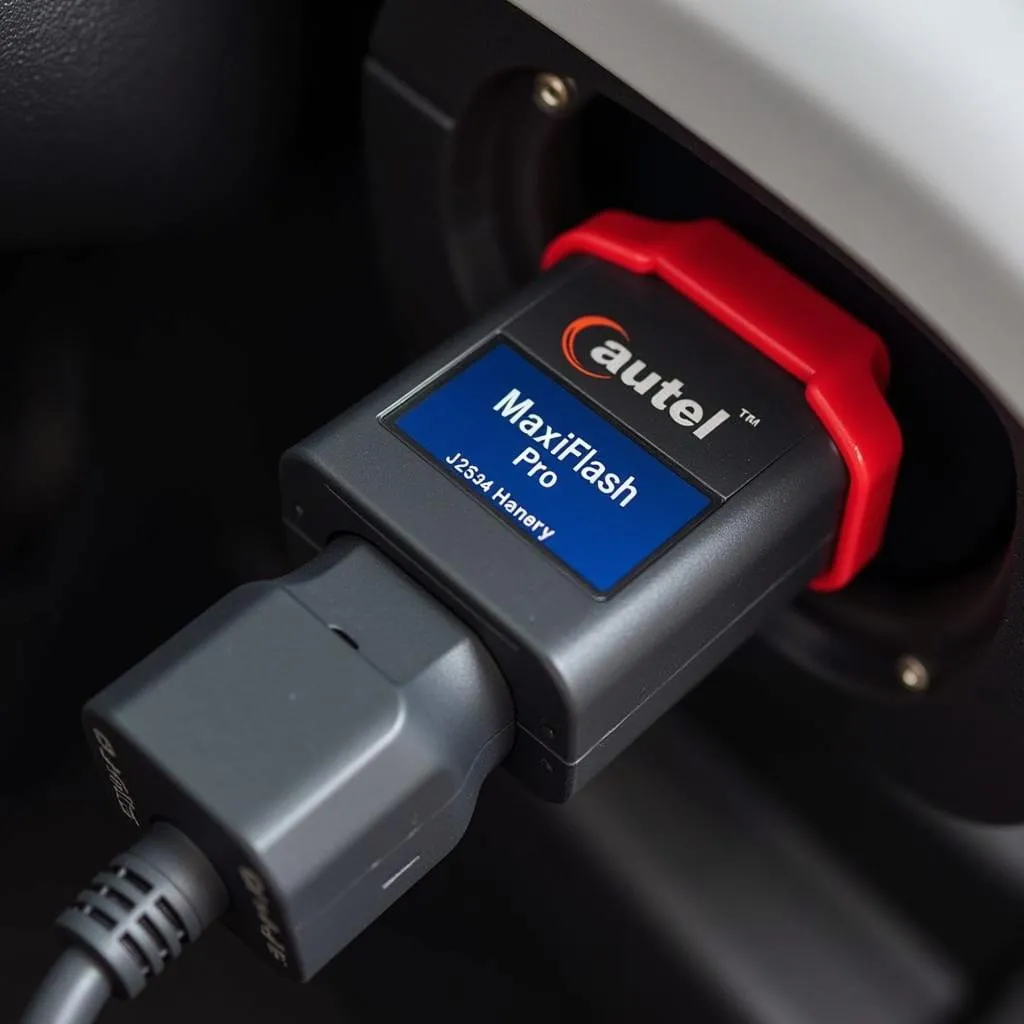 Autel MF2534 connected to a vehicle's OBD-II port