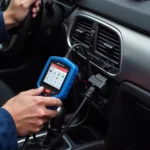 Autel MaxiService VAG505 connected to a car's OBD-II port