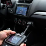 Mazda RX-8 scan tool plugged into the OBD-II port