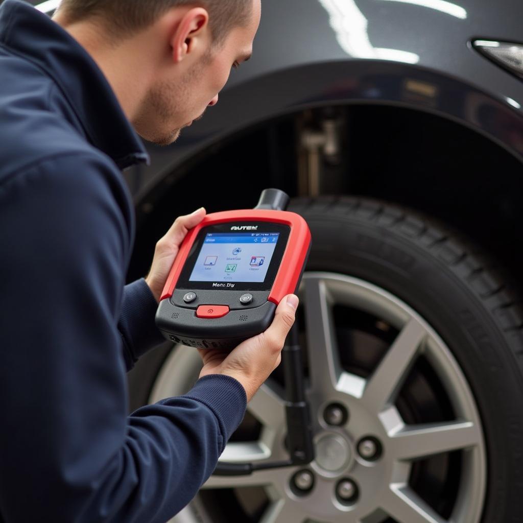 Autel MaxiDiag MD702 in Mechanic's Hand