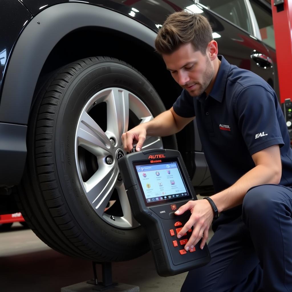 Technician Using Autel TPMS Tester