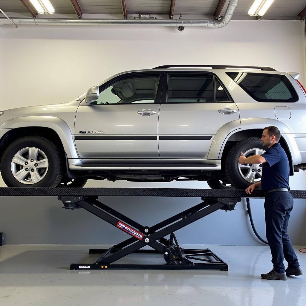 Car on a Scissor Lift for Tire Rotation