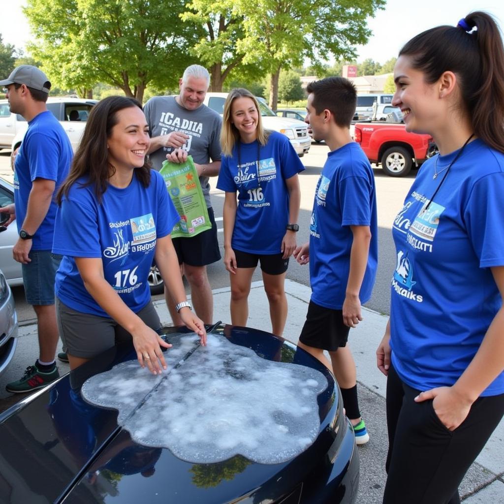 Volunteers working together at a car wash fundraiser