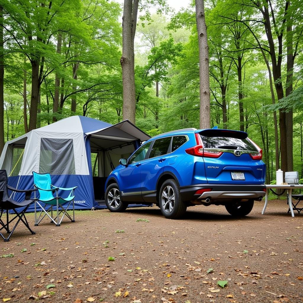 CRV Hybrid parked at a campsite with camping gear set up