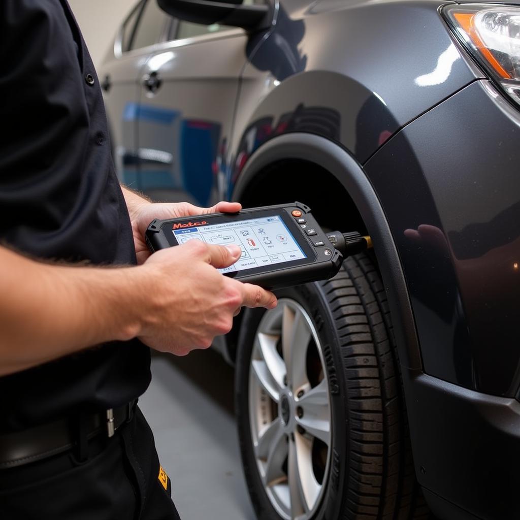 Technician Using Matco MD1022