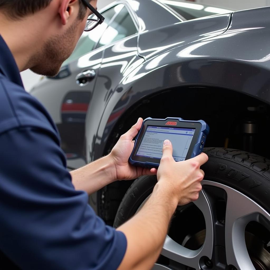 Mechanic Using Autel MaxiCOM MK808BT