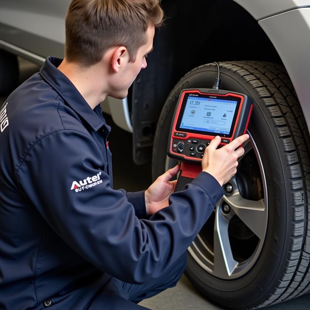 Mechanic Using Autel MD802 Scanner