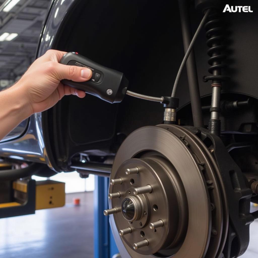 Mechanic Using Autel MV105 Digital Inspection Camera