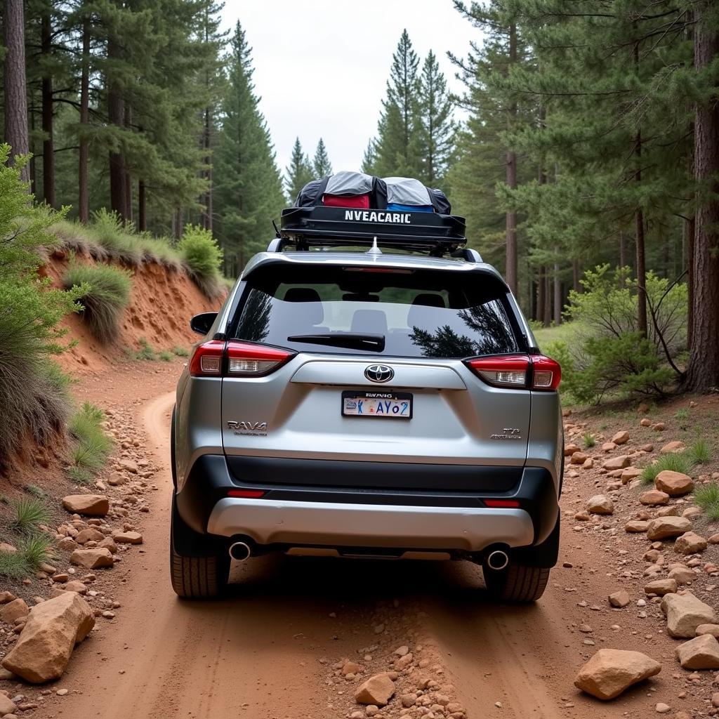 RAV4 Hybrid tackling rough terrain on a car camping trip