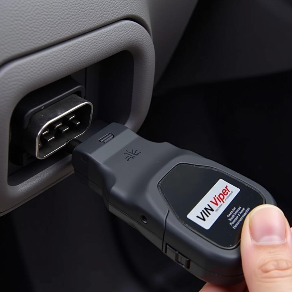 VIN Viper Scanning Tool Connected to a Car's OBD-II Port